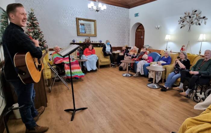 Rhys Andersonsinging to Ruthven Towers residents