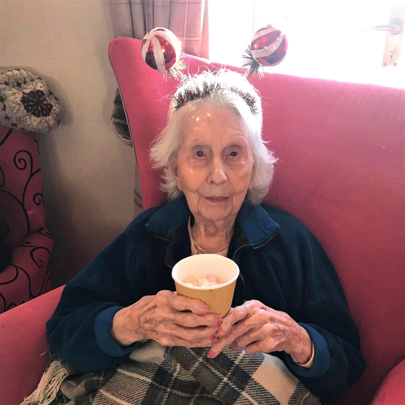 Resident with hot chocolate