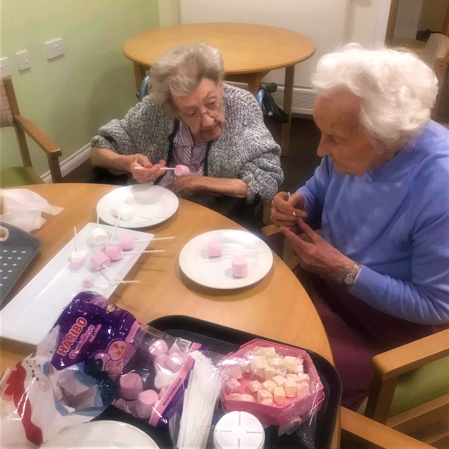 Residents making dipping sweets for melted chocolate