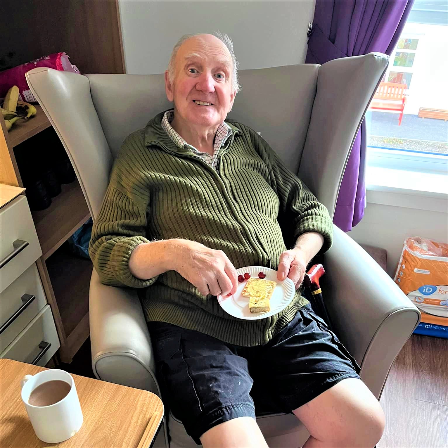 Resident enjoying cheese and crackers