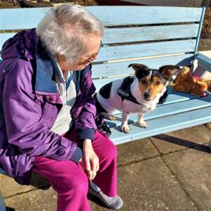 The Glens - resident on a bench with dog