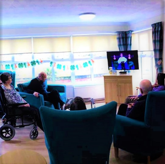 Wheatlands - residents sat in armchairs watching riverdance