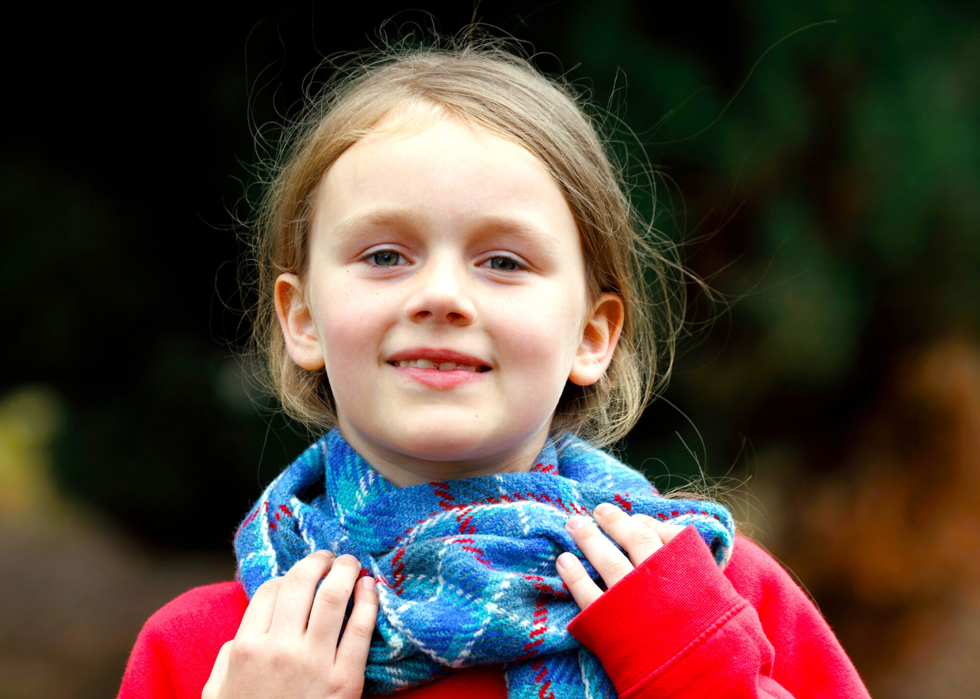school girl with tartan scarf