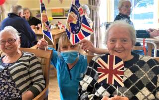 Stormont Lodge - ladies waving flags for jubilee
