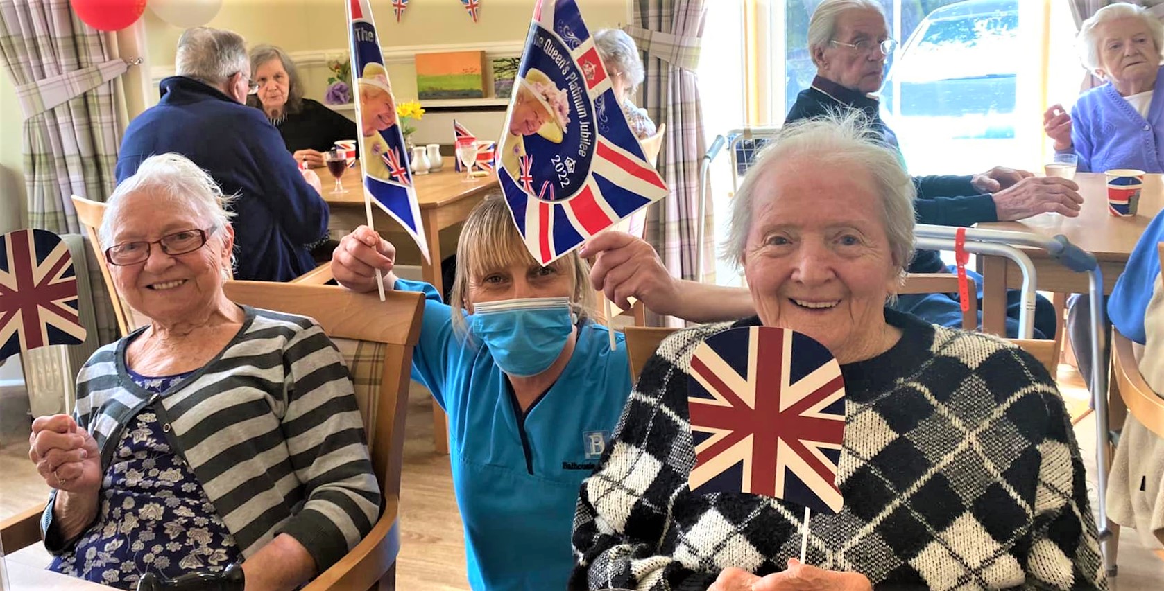 Stormont Lodge - ladies waving flags for jubilee