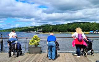 residents and support workers looking out over loch lomond