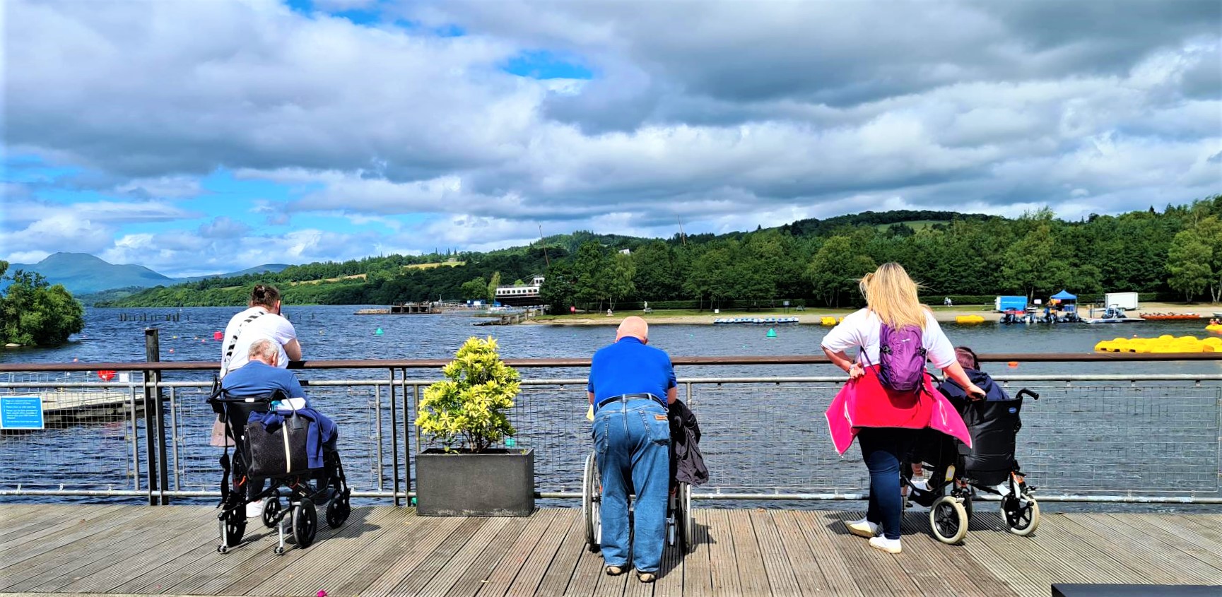 residents and support workers looking out over loch lomond