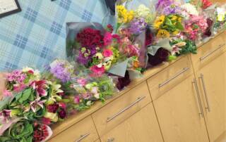 supermarket flower bunches on a sideboard