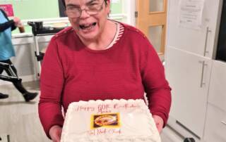 service user with birthday cake