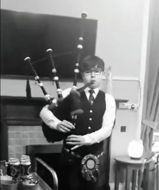 Boy playing bagpipes