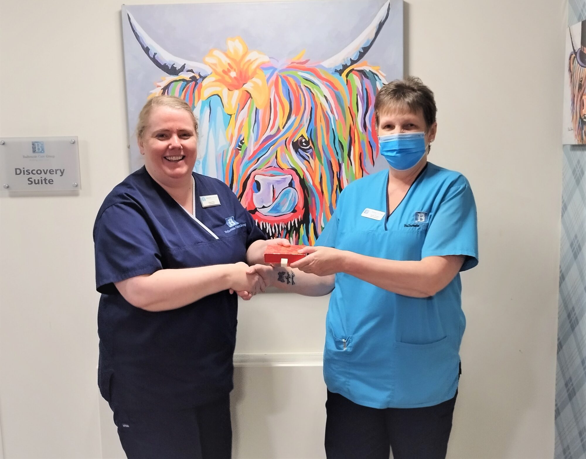 Brew Monday voucher winner Carole Thomson, a Care Assistant from Clement Park with Home Manager Cheryl Roy.