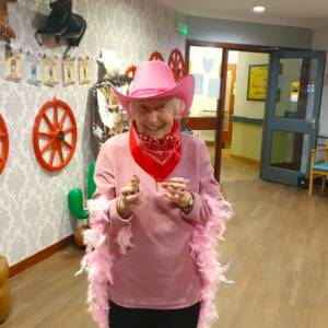 A photo of staff and residents at Balhousie Brookfield enjoying a Western-themed night.