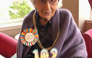 A photo of Balhousie Alastrean resident Isobel celebrating her 102nd birthday.