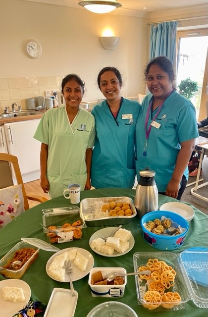 Staff at Balhousie Coupar Angus with their delicacies from Sri Lanka