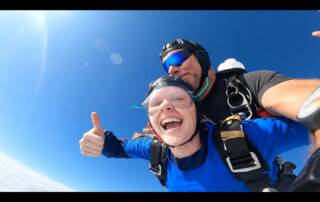 thumbs up live pic of a tandem skydive