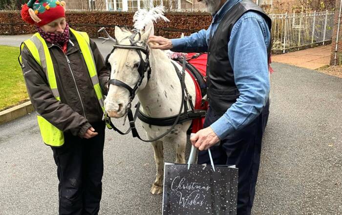 Young at Heart deliver Christmas gifts to residents at Balhousie Alastrean.