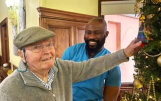 Campbell Burns, resident at Balhousie Ruthven Towers with Care Assistant, Prince Peter.