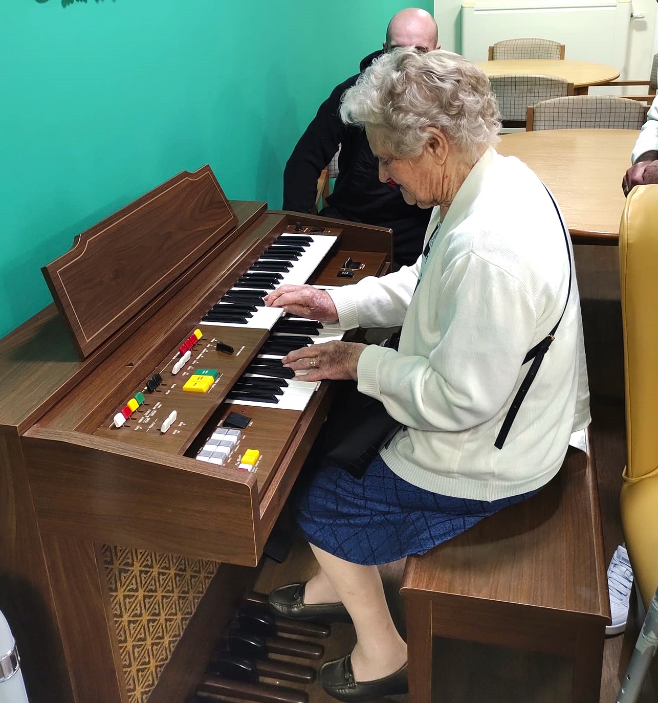 Anne Wallace, a resident from Balhousie Willowbank plays her organ for her family, residents and staff.