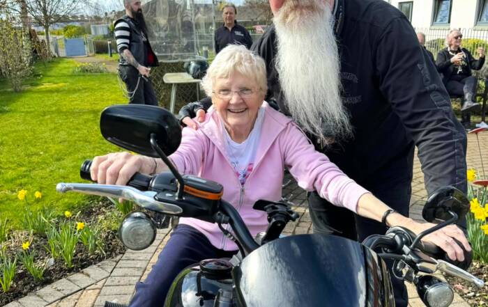 Older lady with long bearded biker