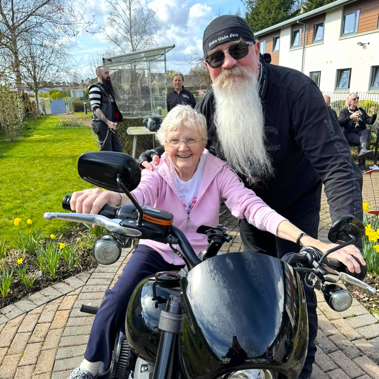 Older lady with long bearded biker
